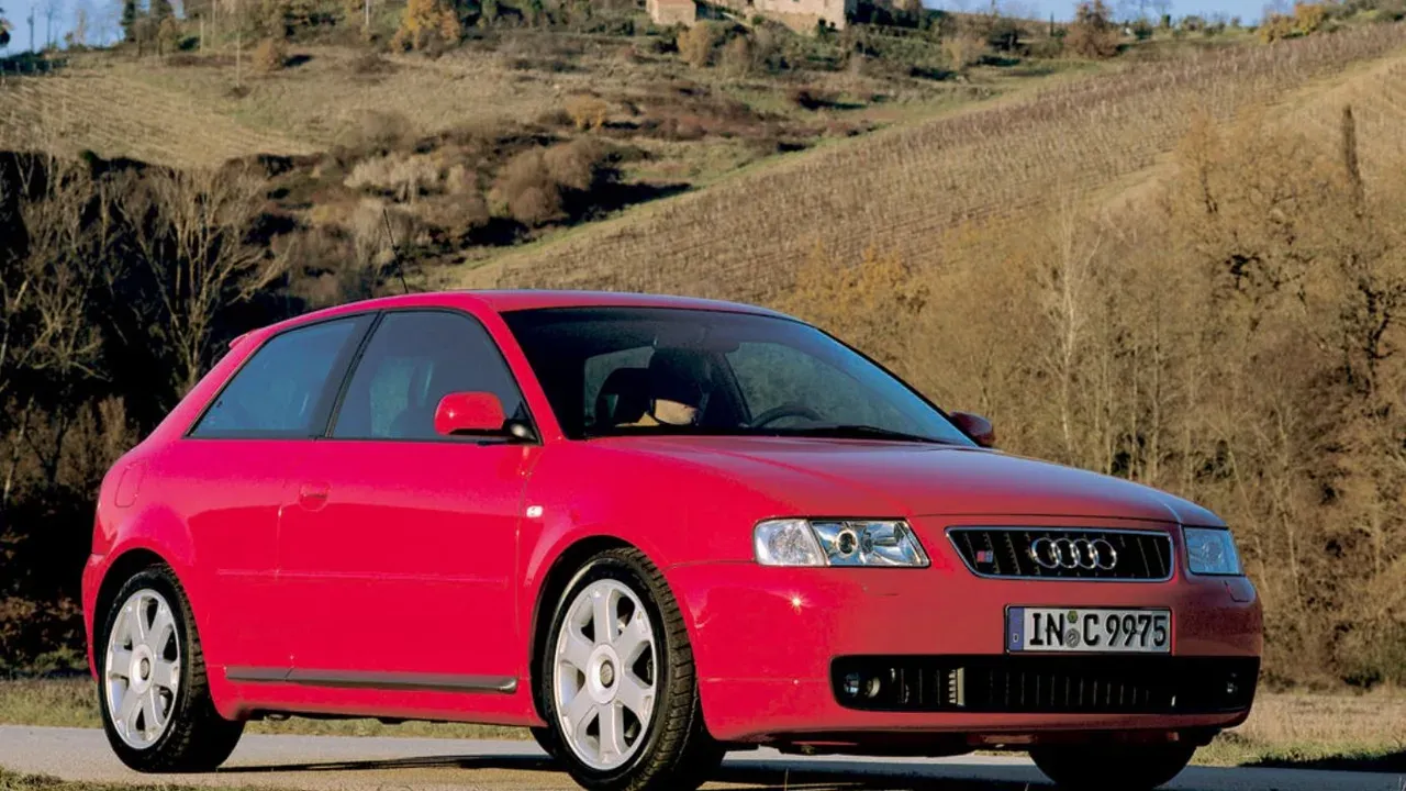 Red first-generation Audi S3 viewed from the front three-quarter angle